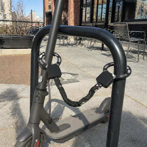 Scooter secured outside a café