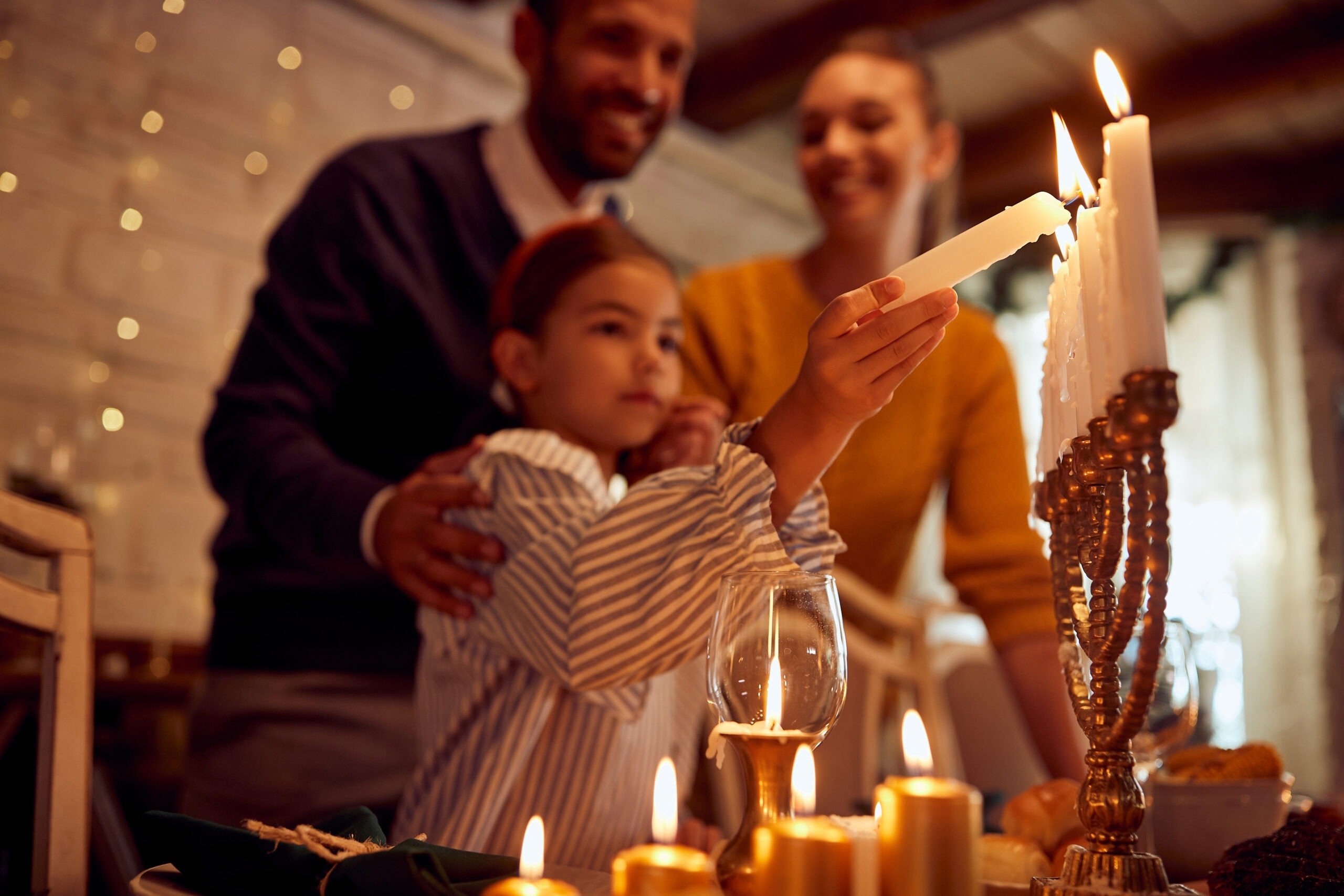 Detailed miniature Hanukkah diorama scene with menorah and figures