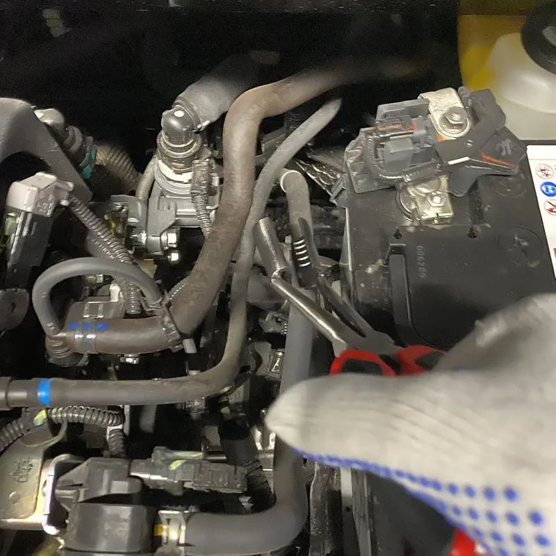 Angled plier head for tight engine spaces
