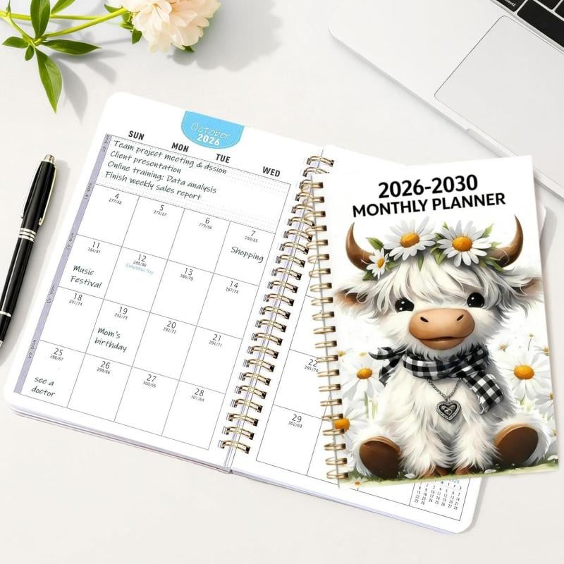 Highland Cow five-year planner on a desk