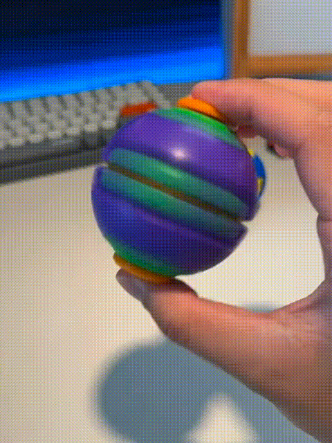 Press-to-spin transforming mechanical fidget toy